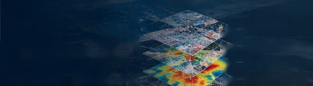 A city seen from above through stacked, semi-transparent analytical map layers, one of them a red and orange heat map